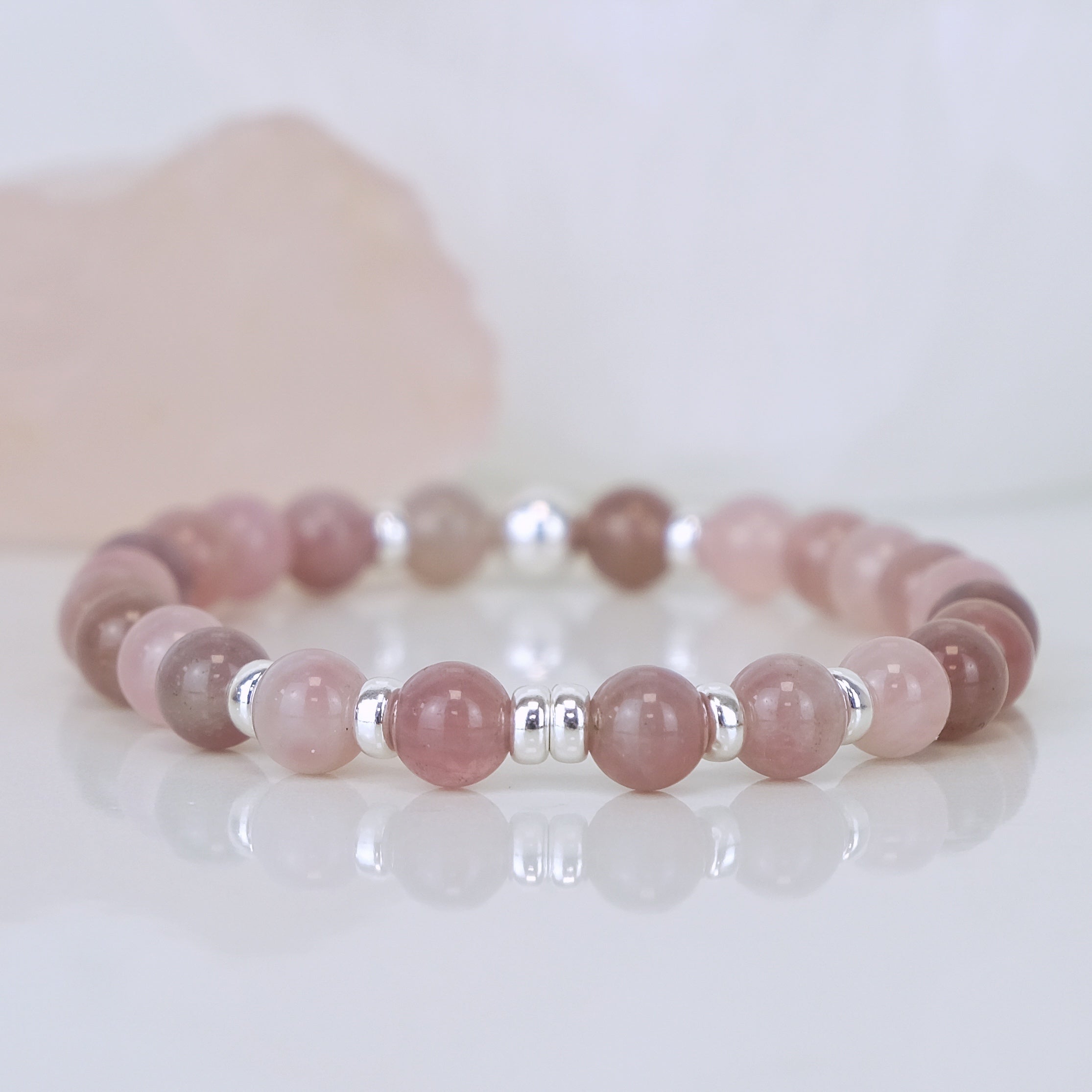 A lavender rose quartz gemstone bracelet in 6mm with 925 sterling silver accessories