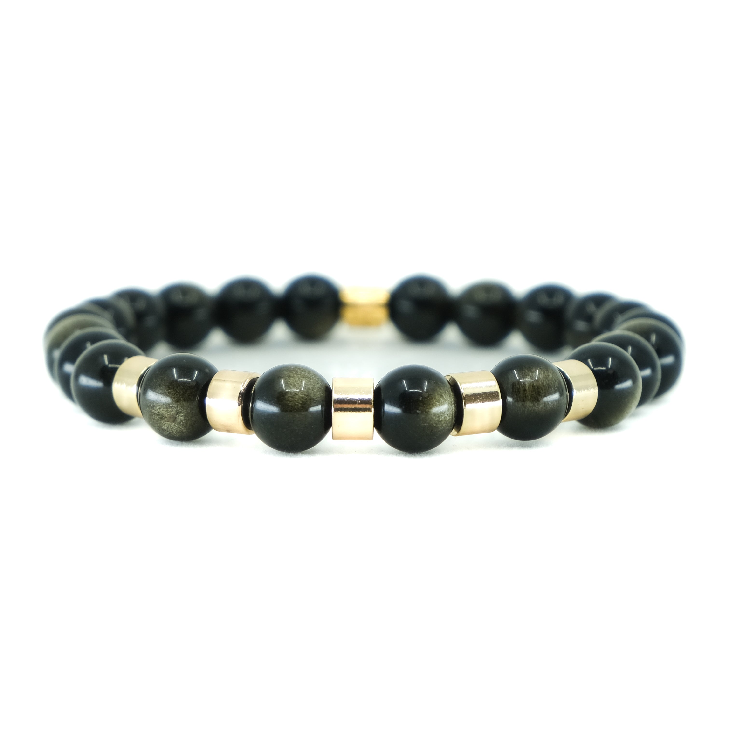 A golden obsidian gemstone bracelet with gold accessories