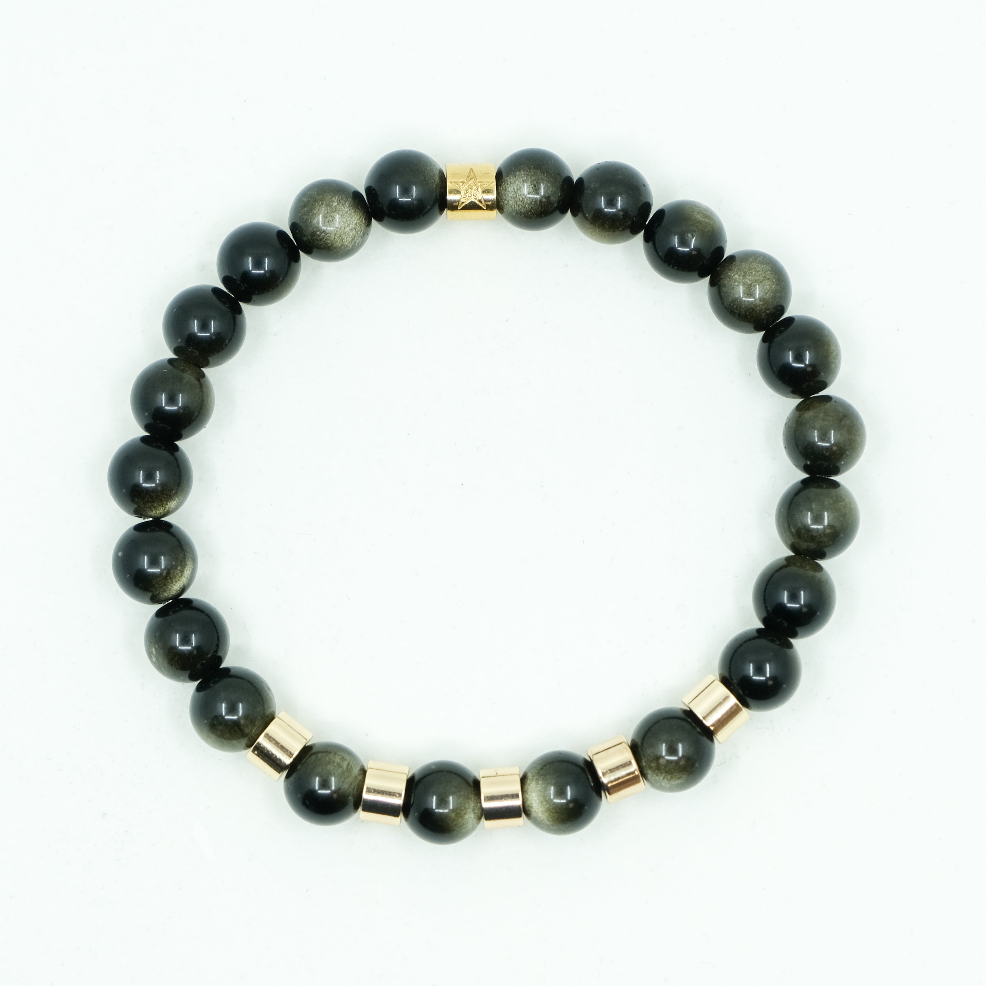 A golden obsidian gemstone bracelet with gold plated accessories from above
