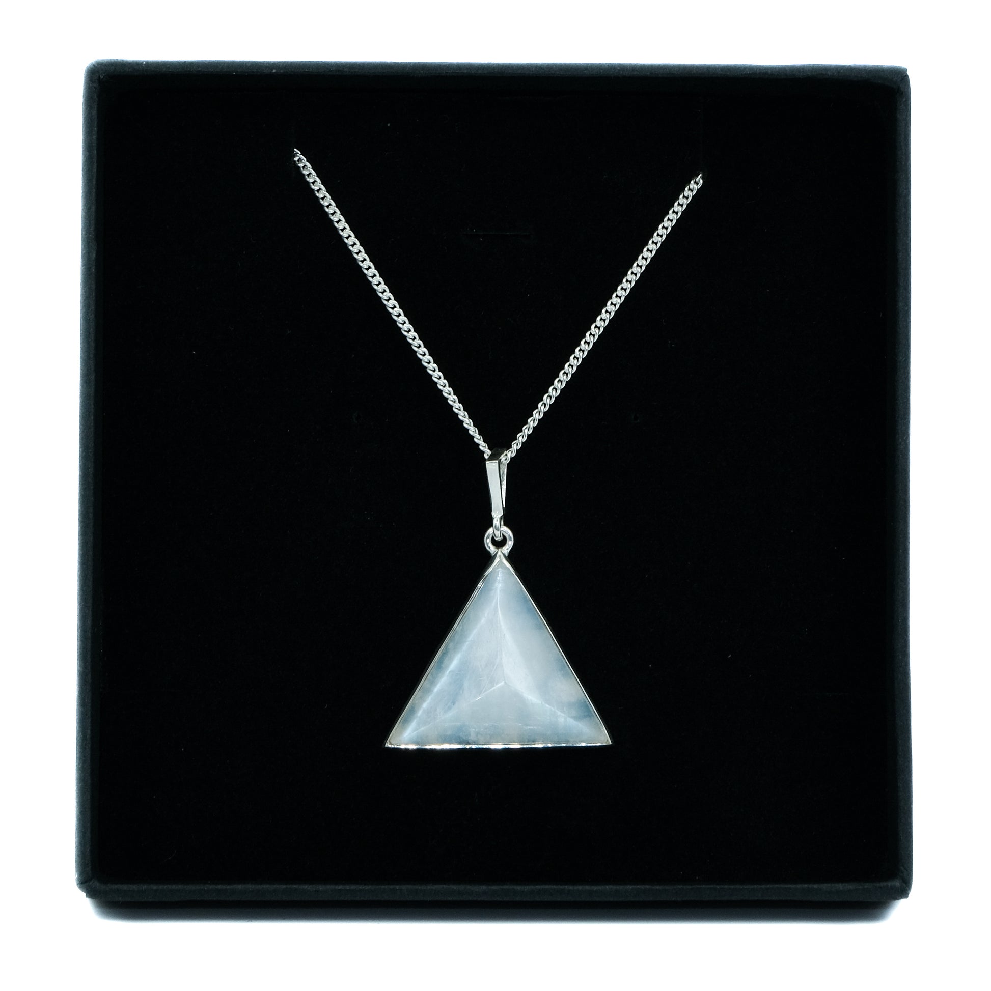A Moonstone gemstone triangle pendant in a jewellery box