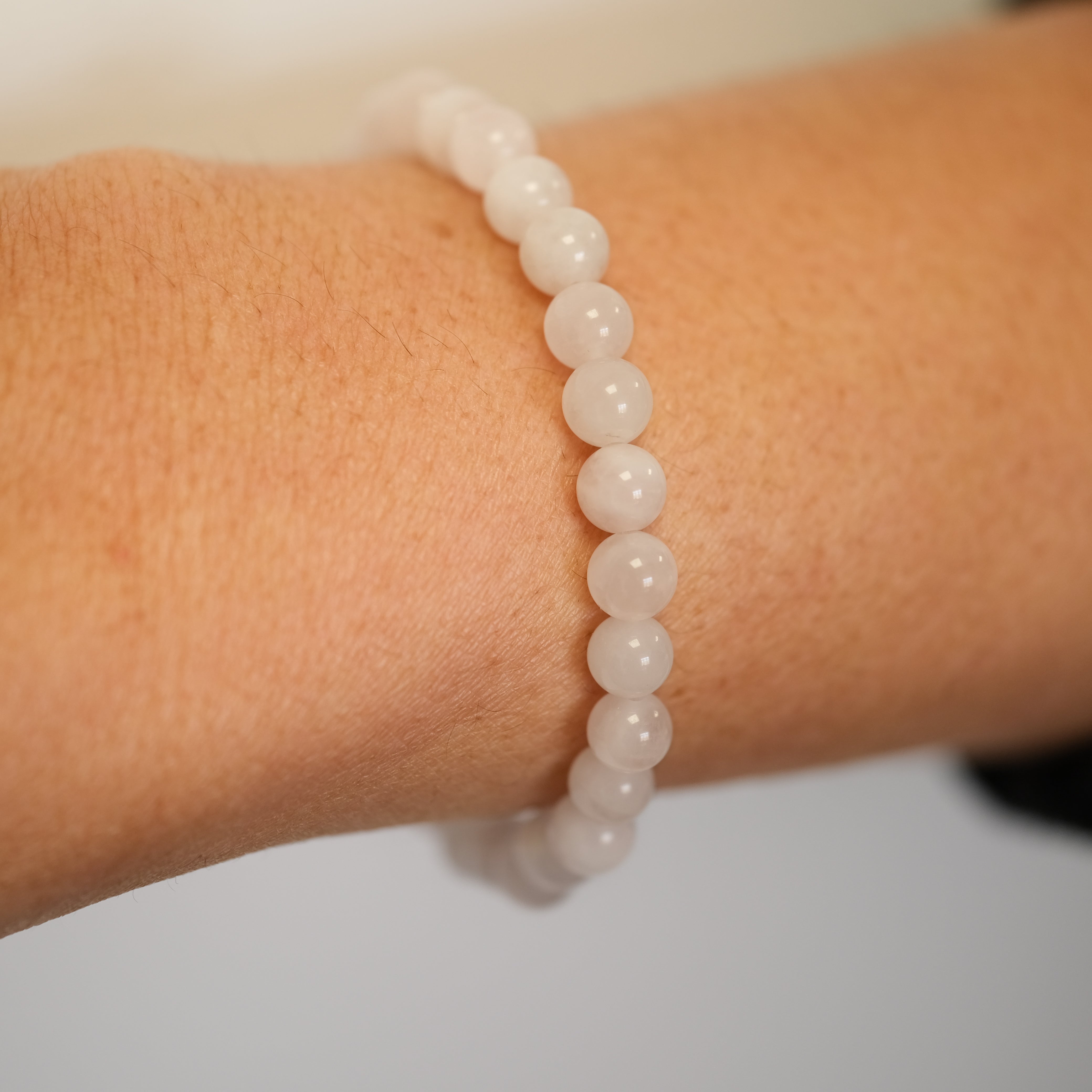 Rose Quartz gemstone bracelet worn on a model's wrist