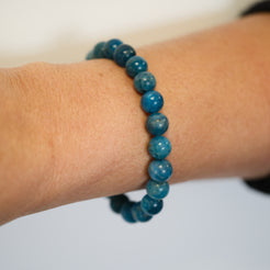 Apatite gemstone bracelet worn on a model's wrist