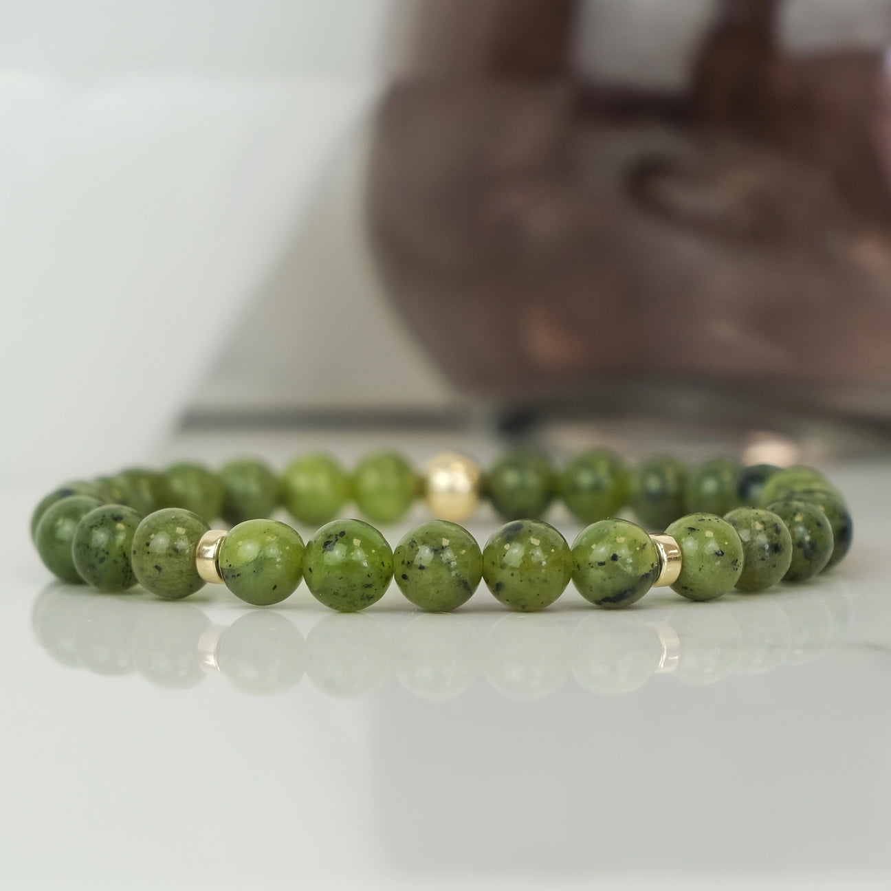 A Green Jade gemstone bracelet with gold filled accessories