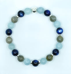 A Kyanite, Aquamarine and Labradorite gemstone bracelet with silver accessories from above 