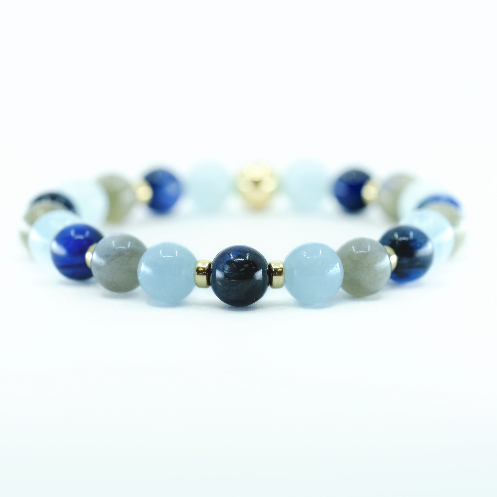 A Kyanite, Aquamarine and Labradorite gemstone bracelet with gold accessories  
