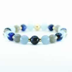 A Kyanite, Aquamarine and Labradorite gemstone bracelet with gold accessories  