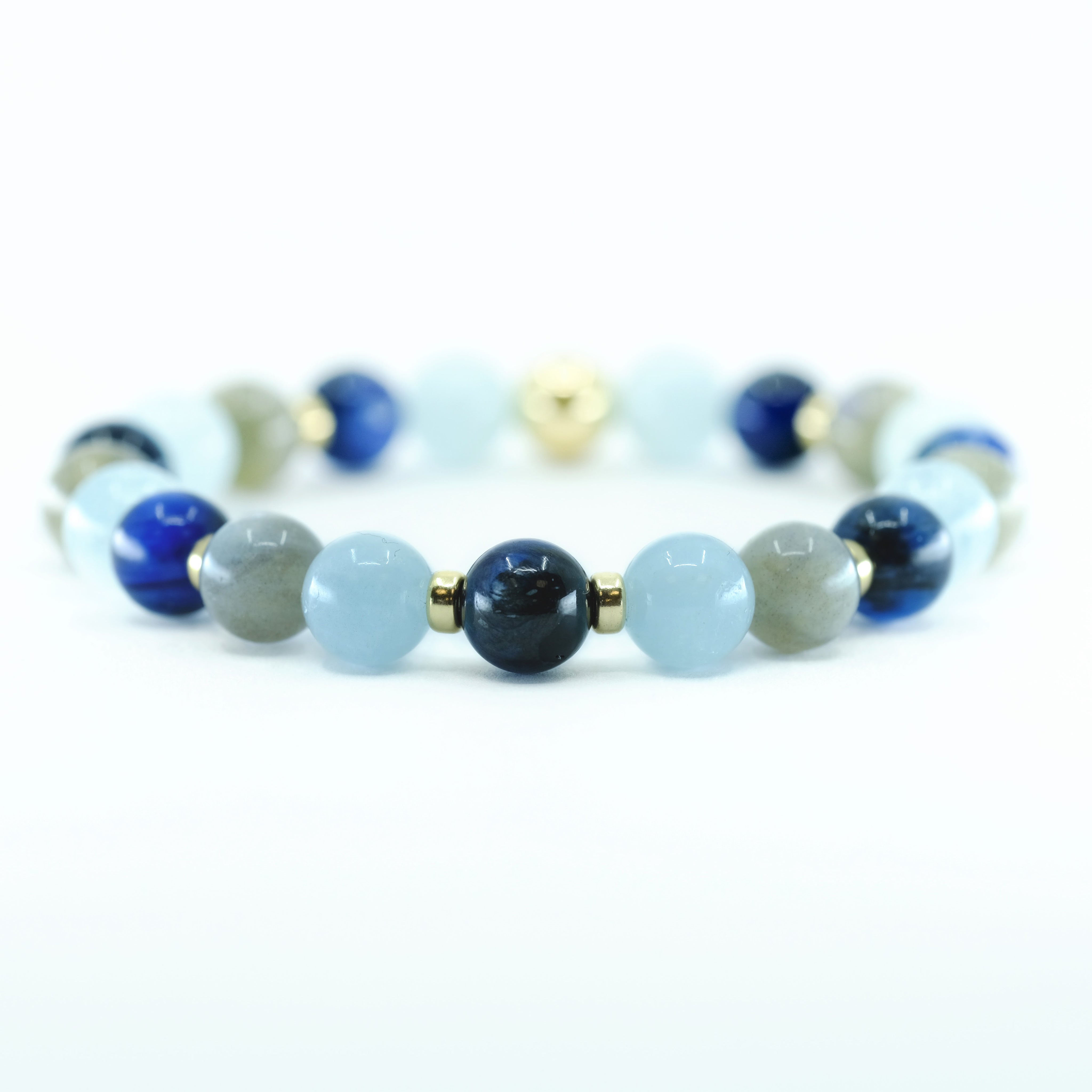 A Kyanite, Aquamarine and Labradorite gemstone bracelet with gold accessories  
