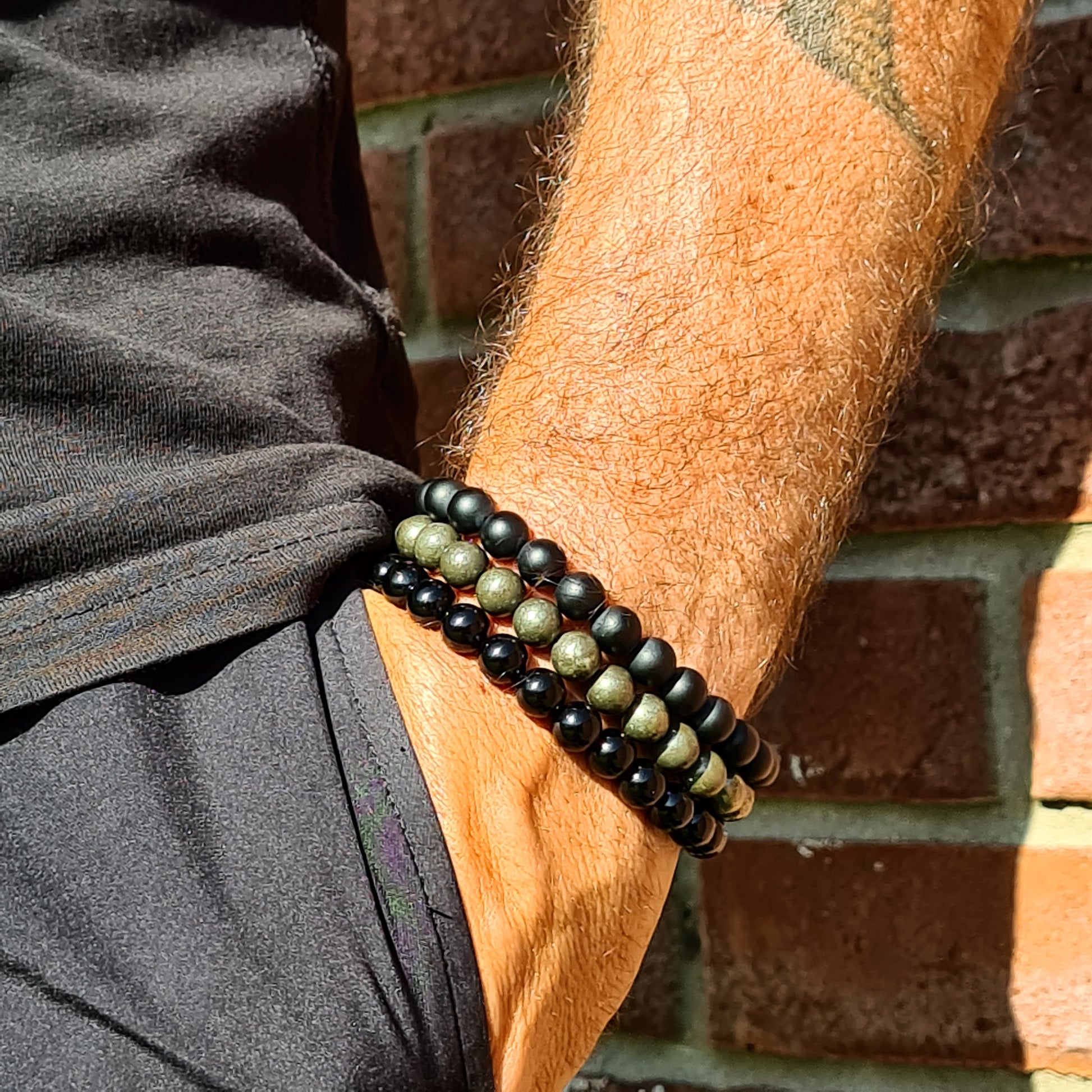 Model wearing a stack of Samayla bracelets 