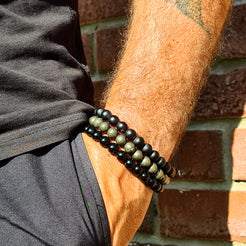 Model wearing a stack of Samayla bracelets 