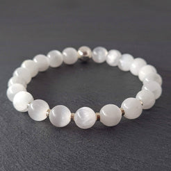 Samayla Jewellery's Selenite energy gemstone bracelet with silver accents, photographed on a dark grey slate.