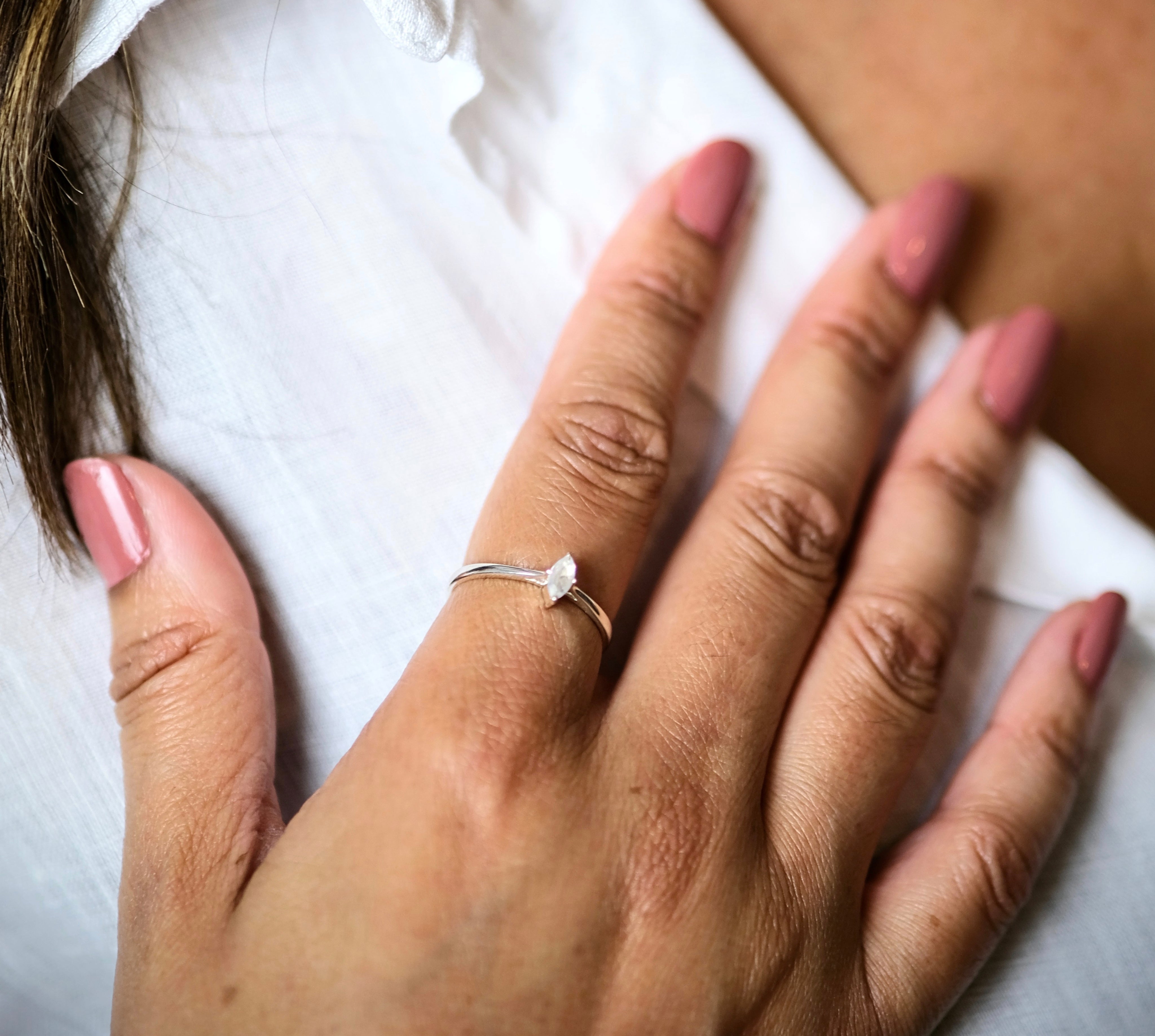 A model wearing Moonstone minimal marquis gemstone ring