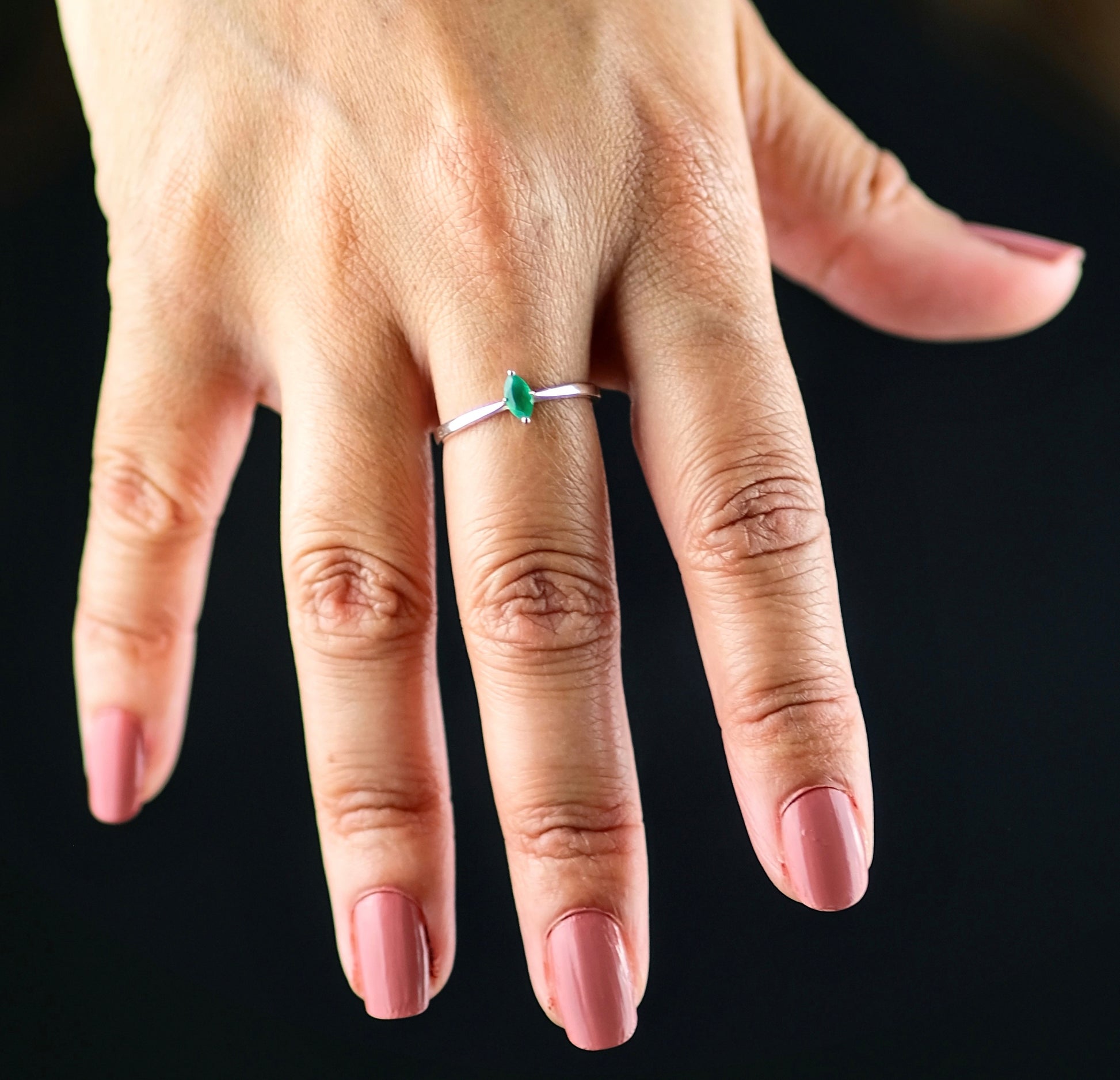 A model wearing a Green onyx minimal marquis gemstone ring in silver