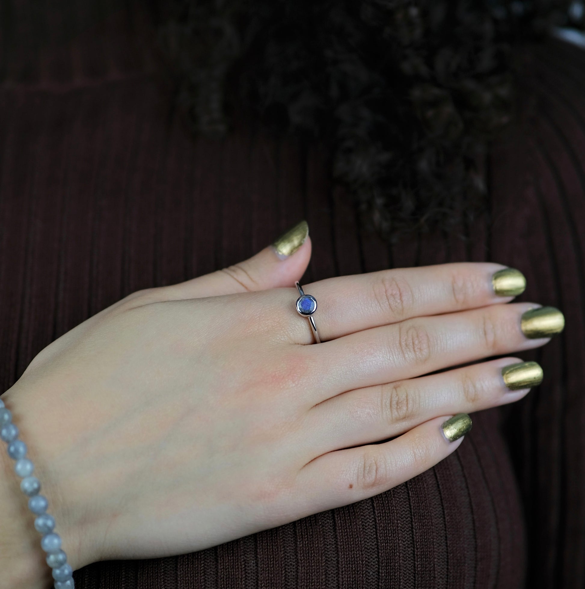 A model wearing Labradorite minimal circle gemstone ring in silver