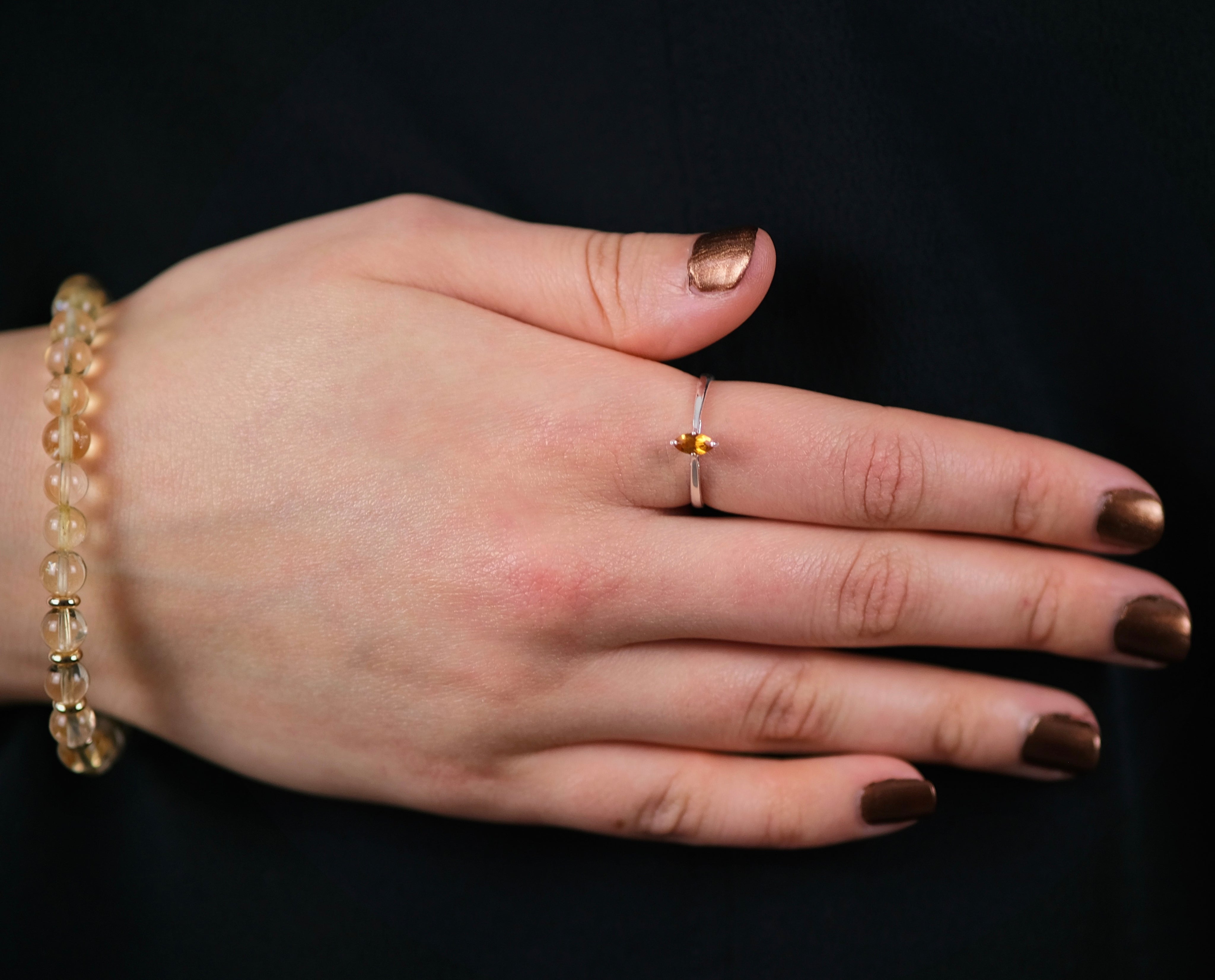 A model wearing Citrine gemstone ring in marquis setting