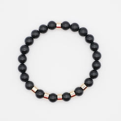 A shungite gemstone bracelet with gold accessories from above