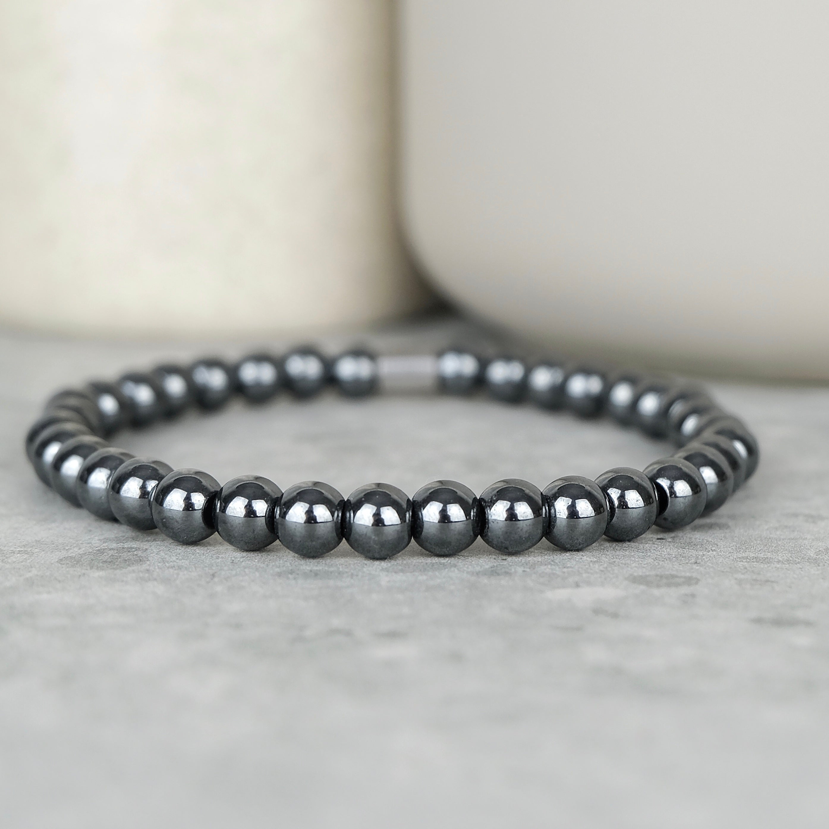 Hematite gemstone bracelet in 6mm beads with steel accessory