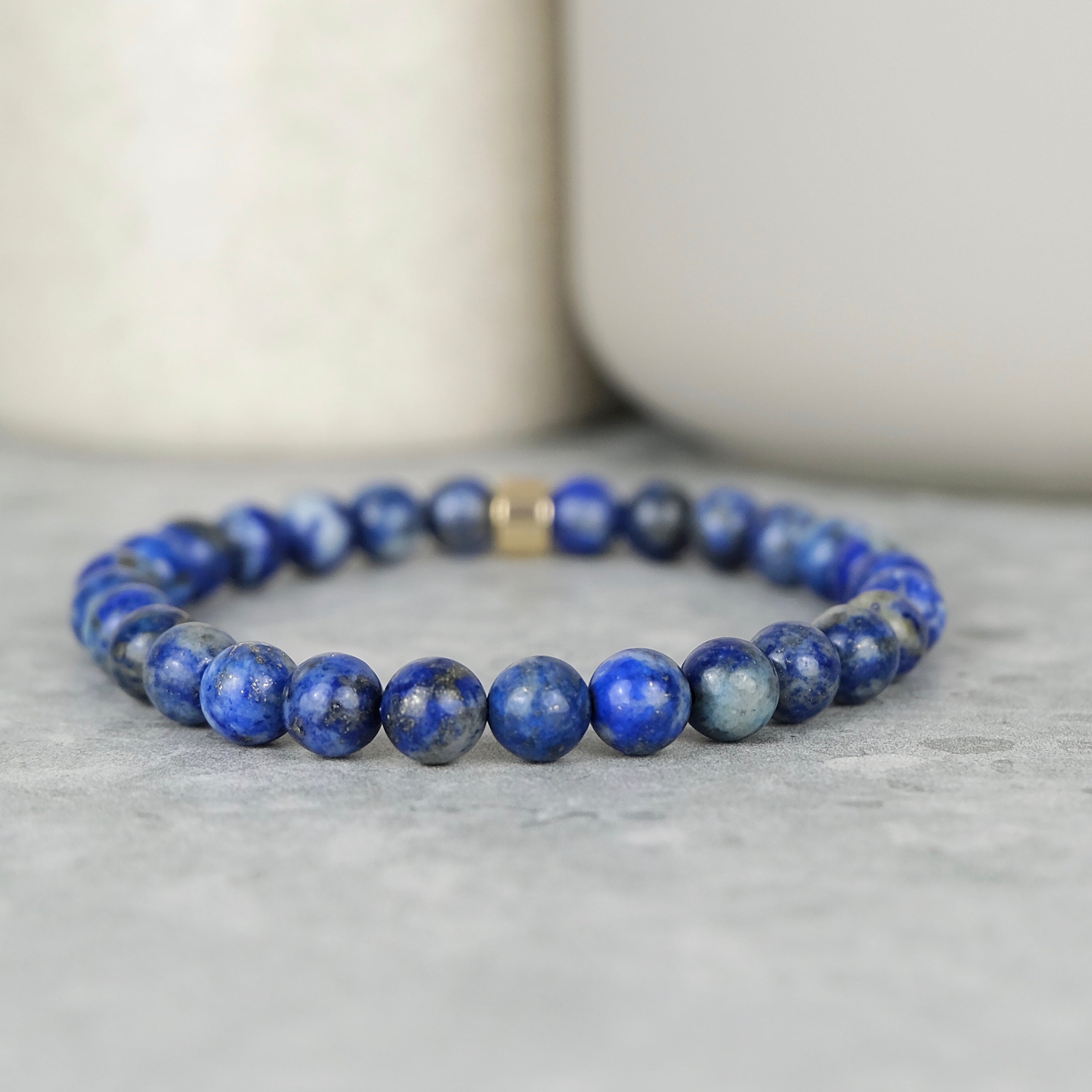 Lapis lazuli gemstone bracelet in 6mm beads with gold accessory