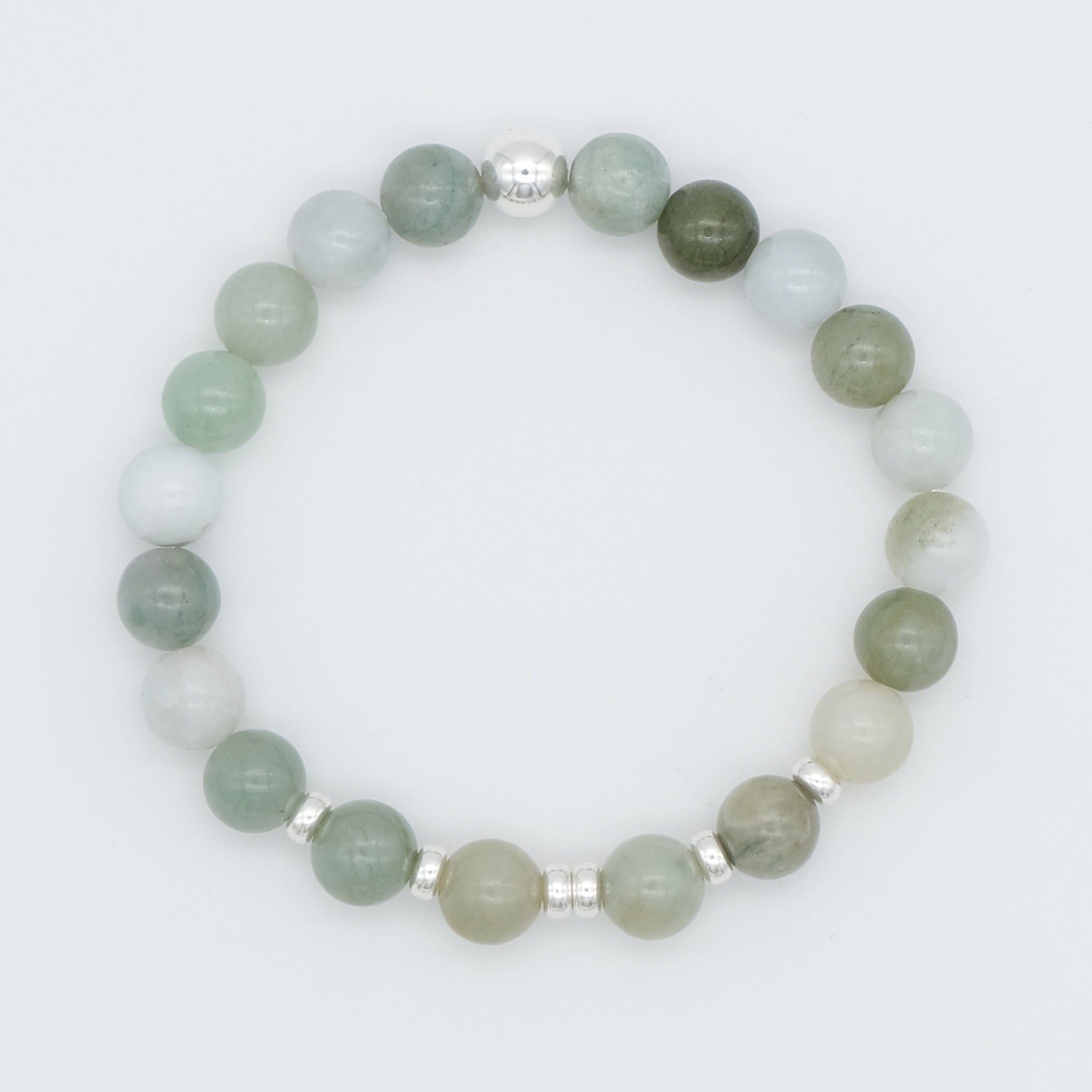 A jade gemstone bracelet with silver accessories from above