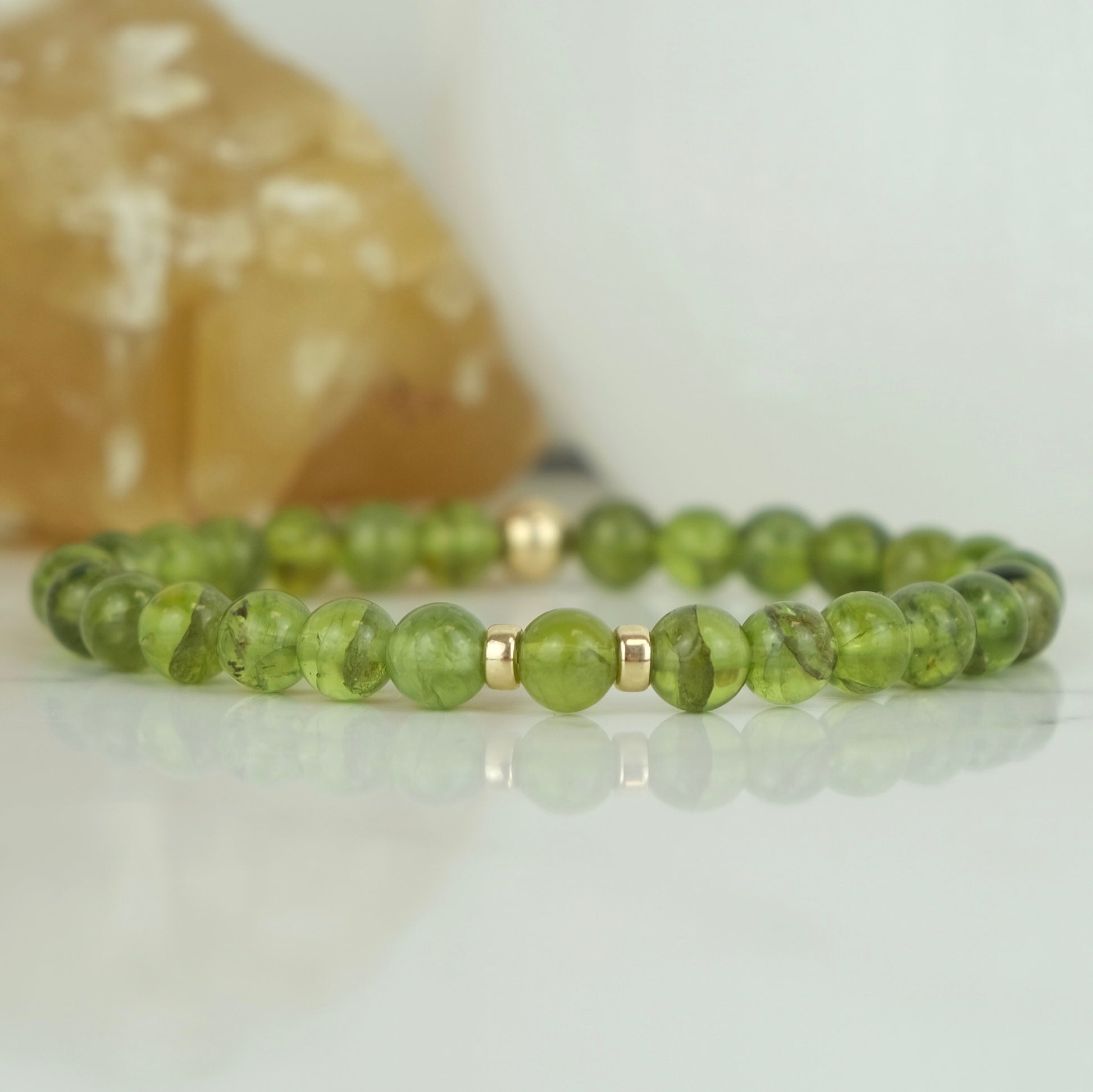Peridot beaded gemstone healing bracelet with gold filled accessories