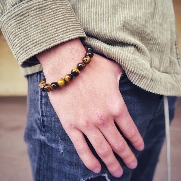 Tiger Eye gemstone bracelet worn on a model's wrist