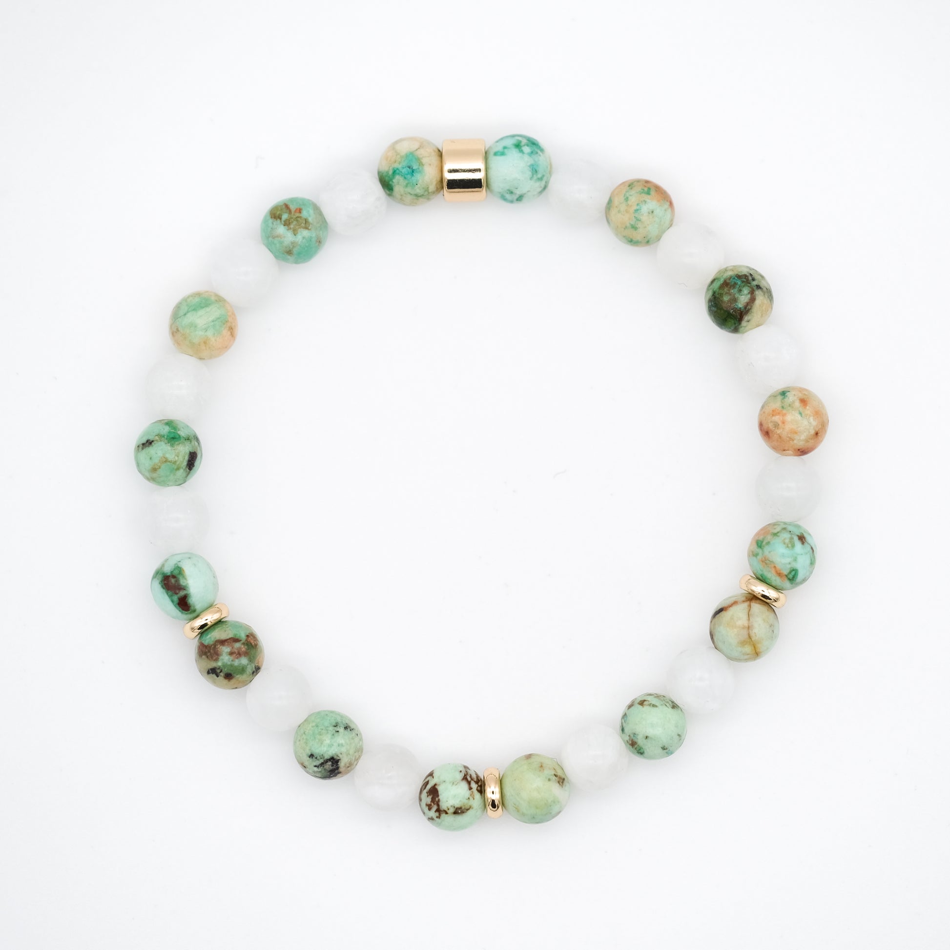 A moonstone and chrysocolla gemstone bracelet in 6mm beads with gold accessories from above