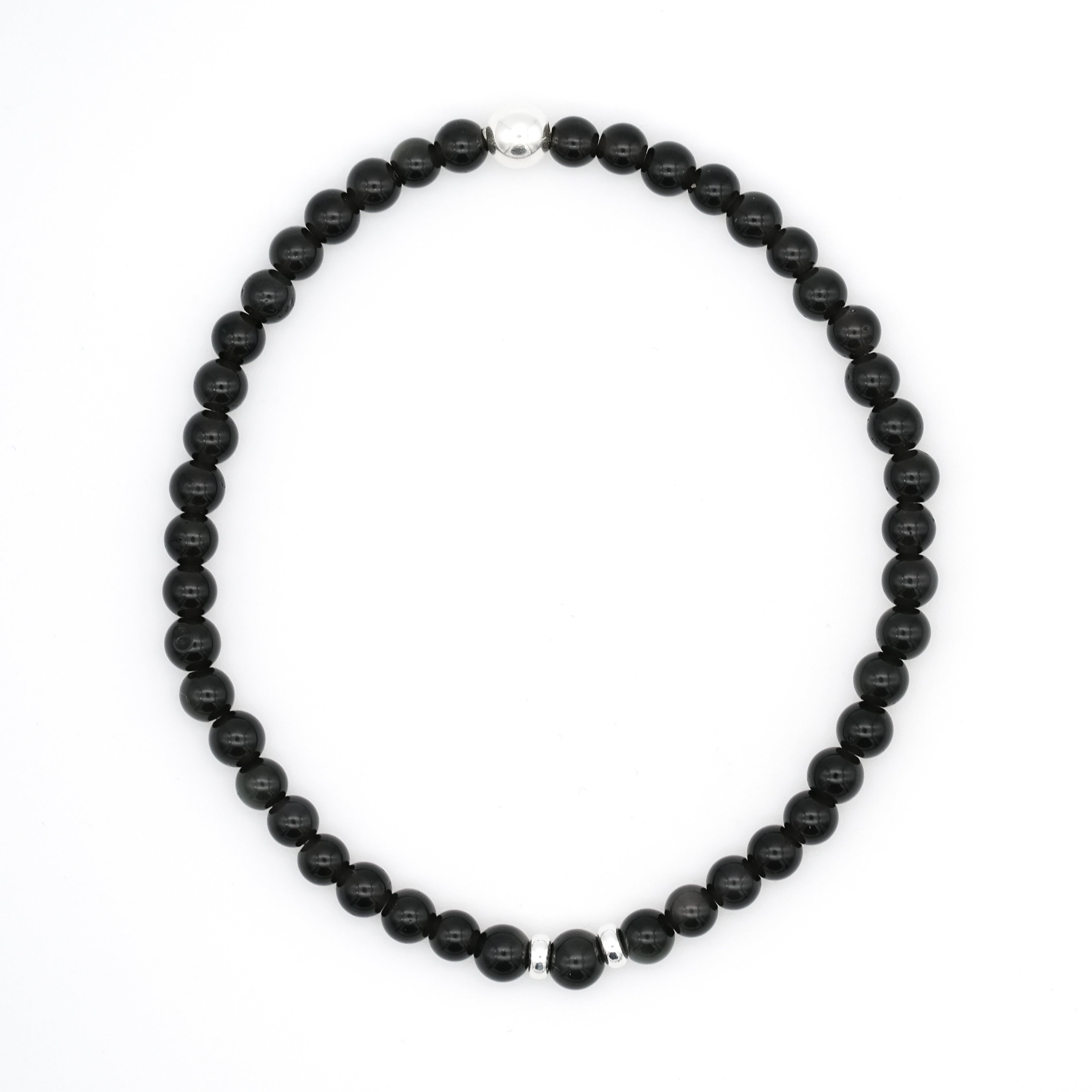 A Black obsidian gemstone bracelet in 4mm beads with silver accessories from above