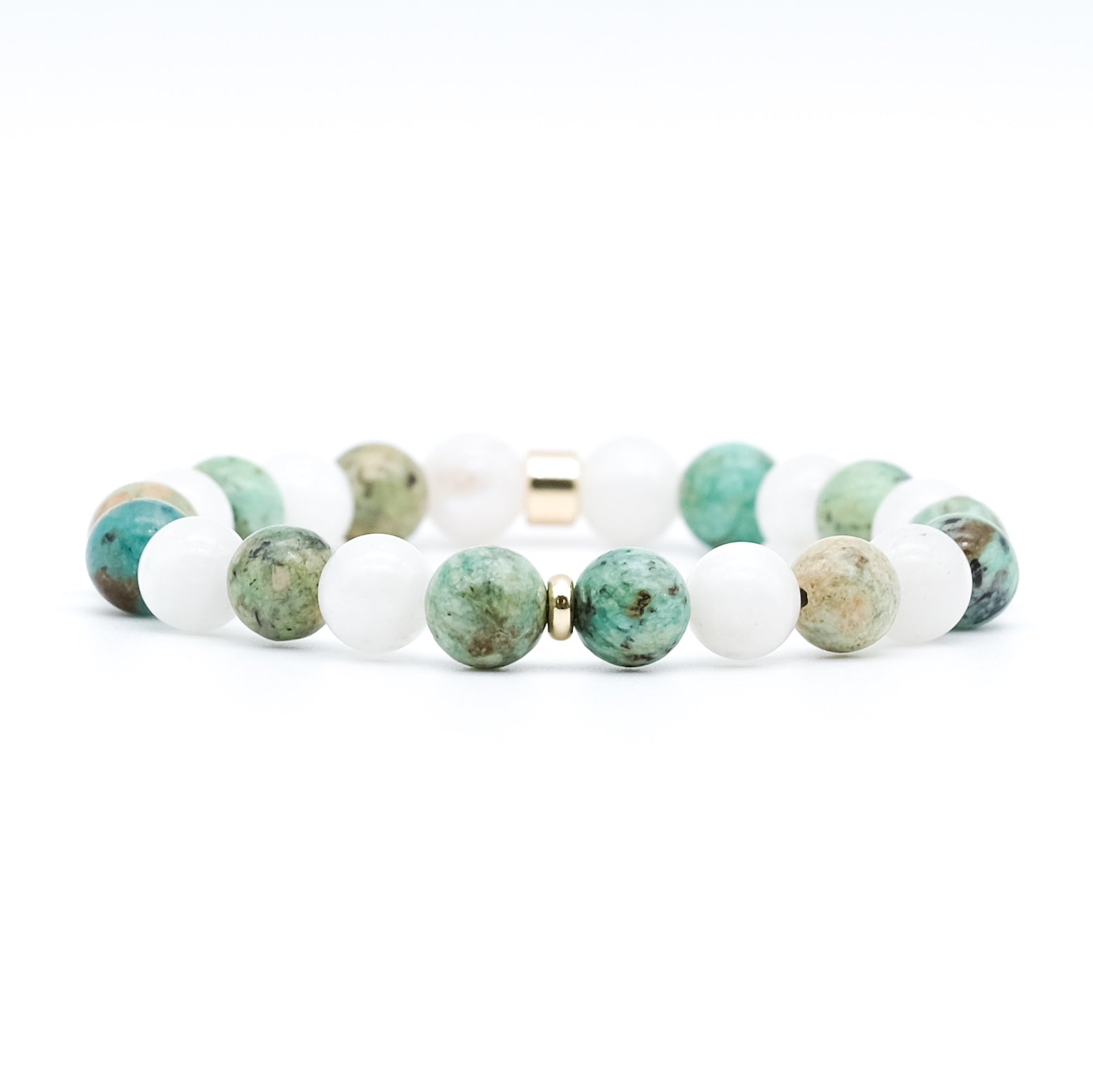 A moonstone and chrysocolla gemstone bracelet with gold accessories