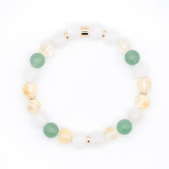 An aventurine, moonstone and citrine gemstone bracelet with gold accessories from above