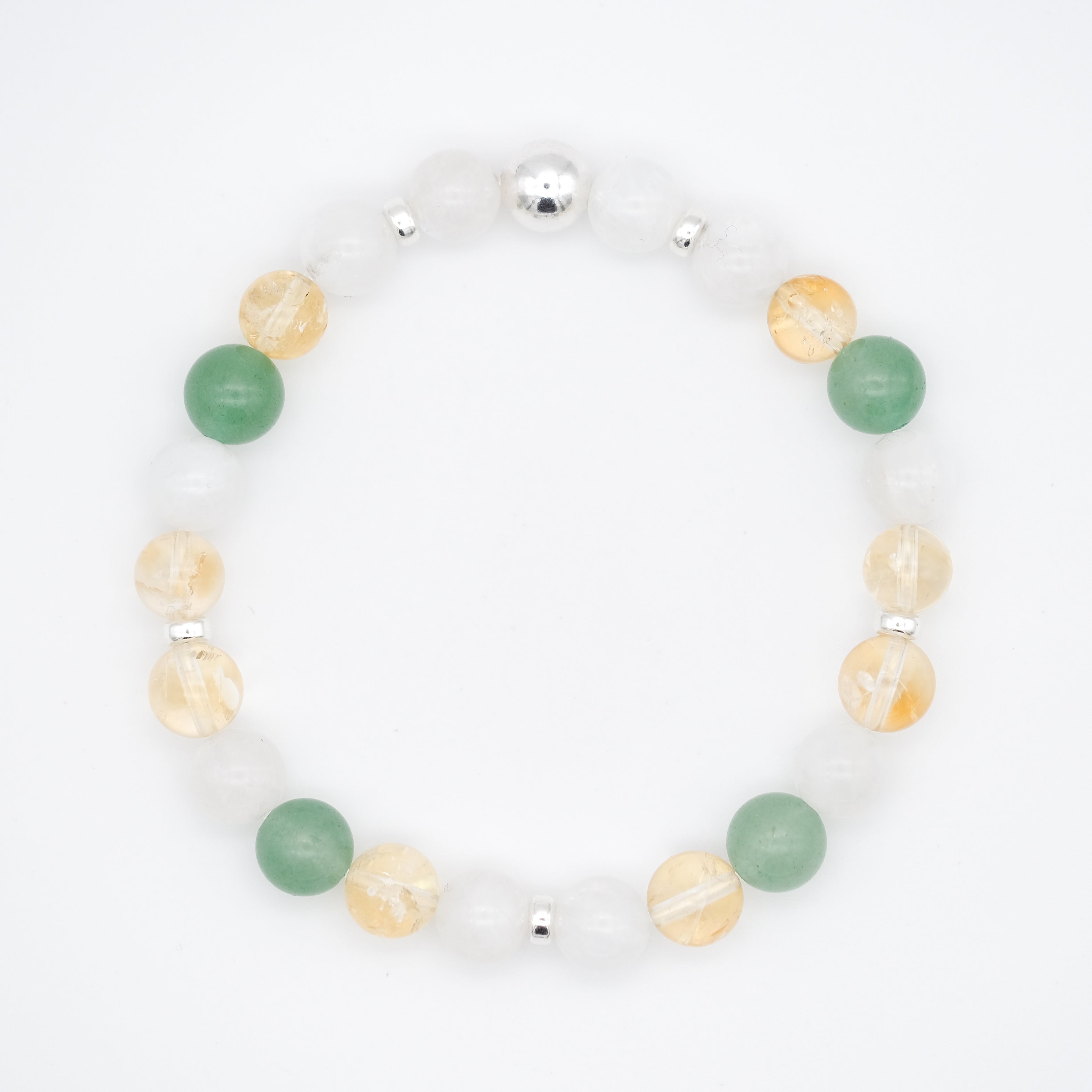 An aventurine, moonstone and citrine gemstone bracelet with silver accessories from above