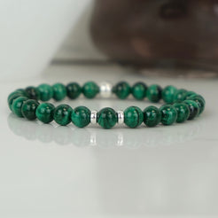 A malachite gemstone bracelet with silver accessories
